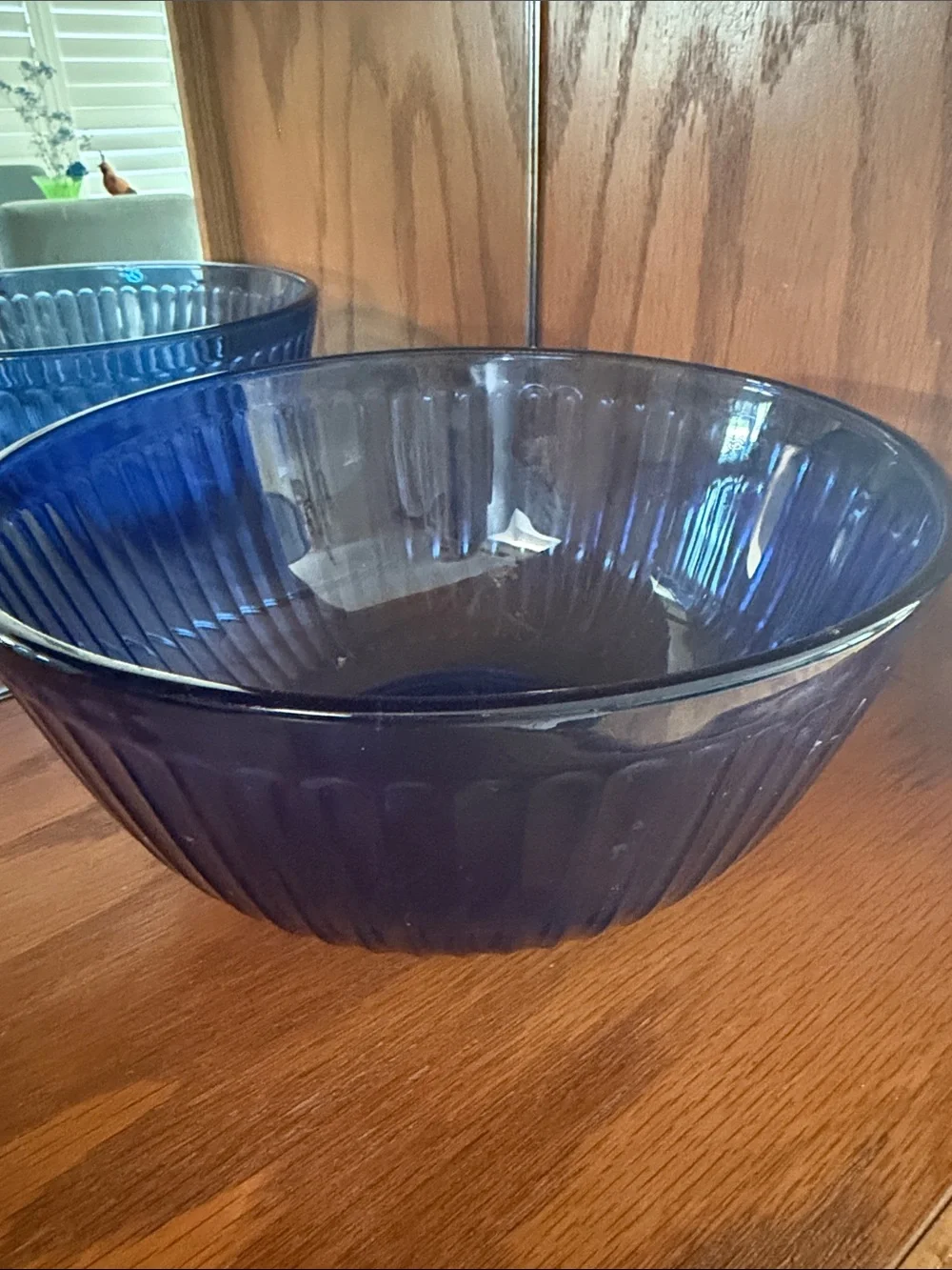 A vintage Pyrex Sculptured mixing bowl in cobalt blue glass.